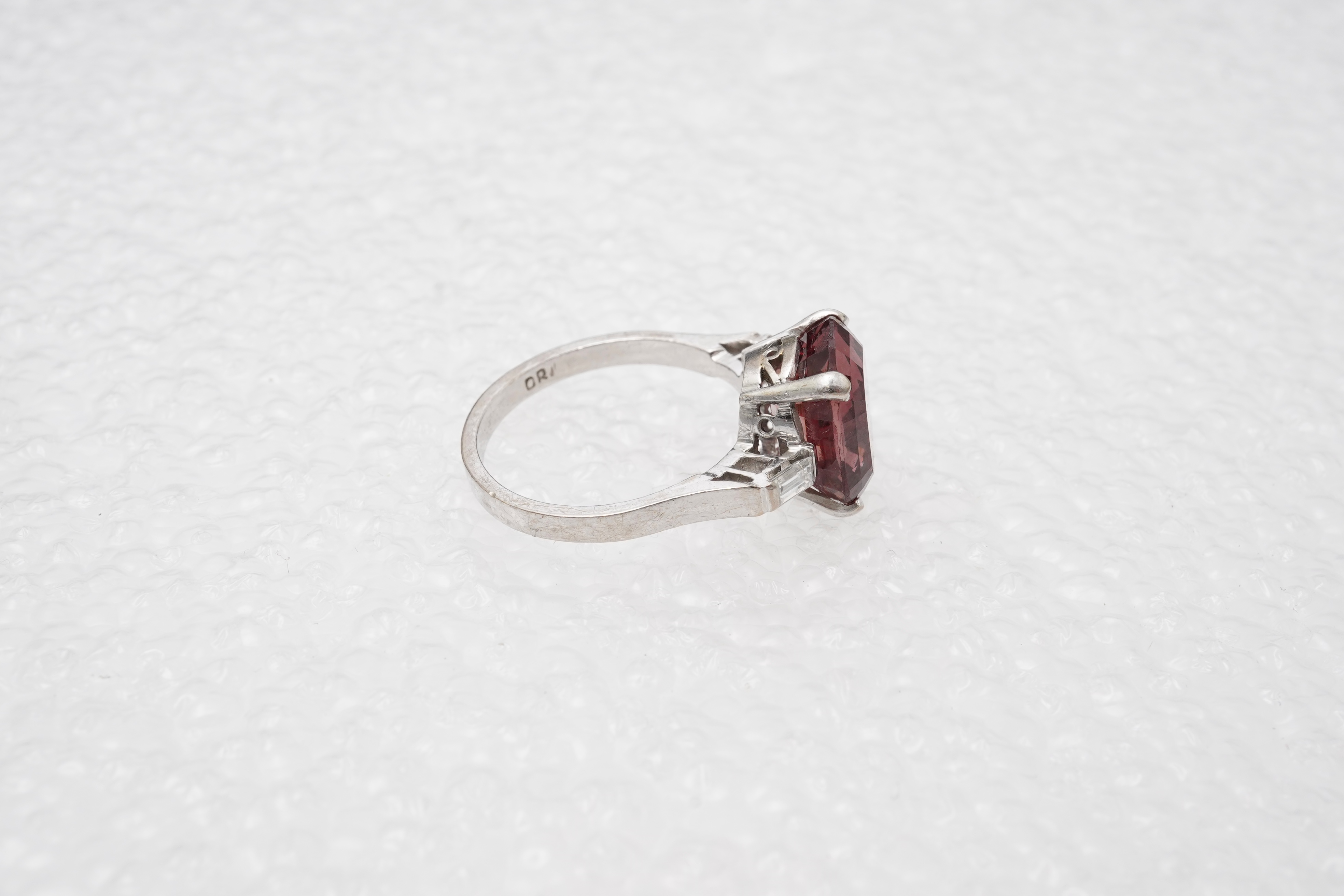 A garnet and diamond ring